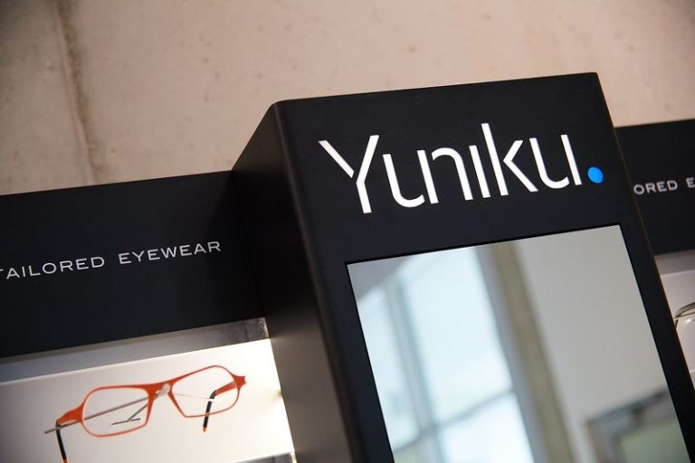 Custom eyewear displayed on a Yuniku stand