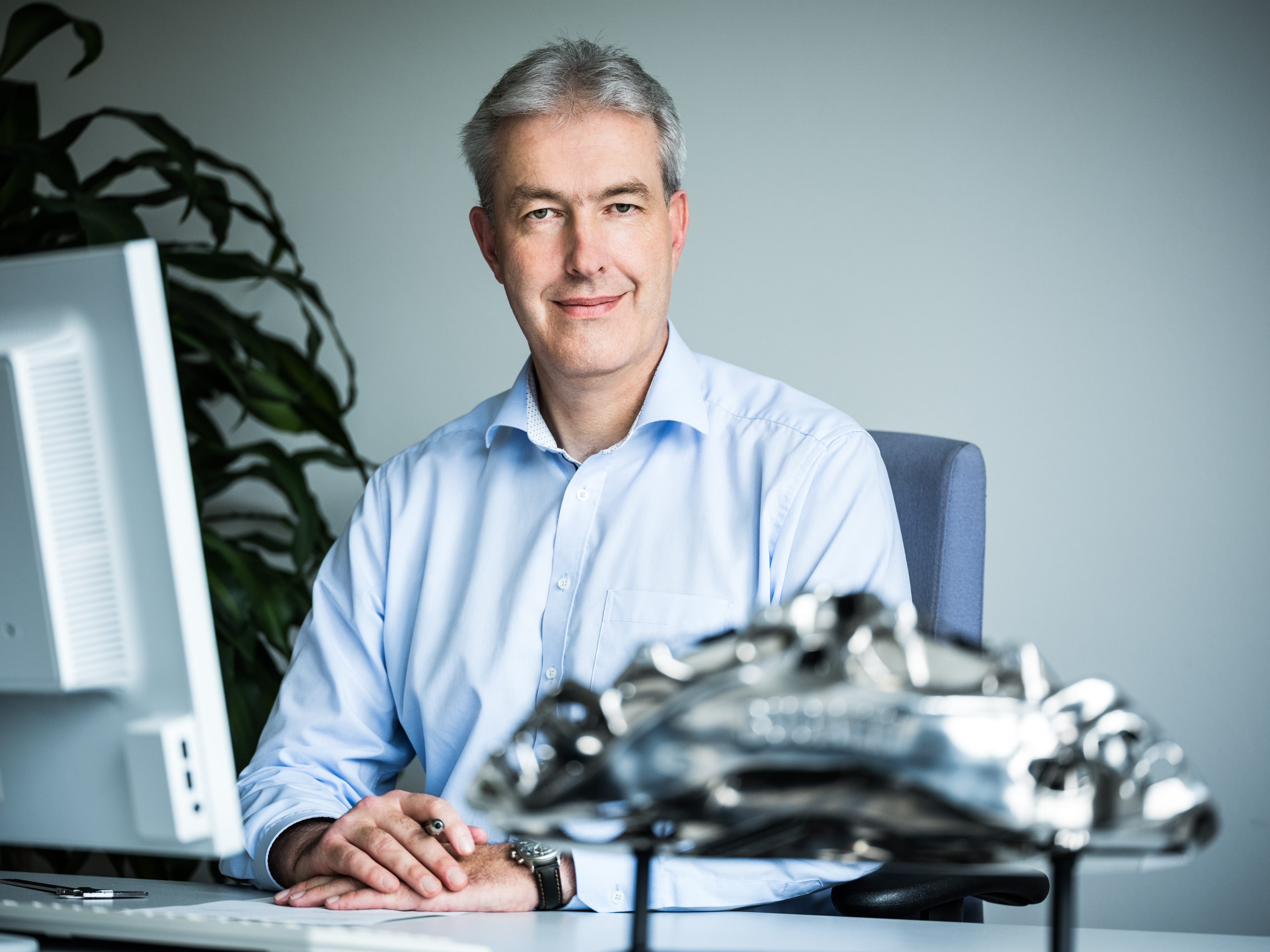 Frank Götzke beside automotive components