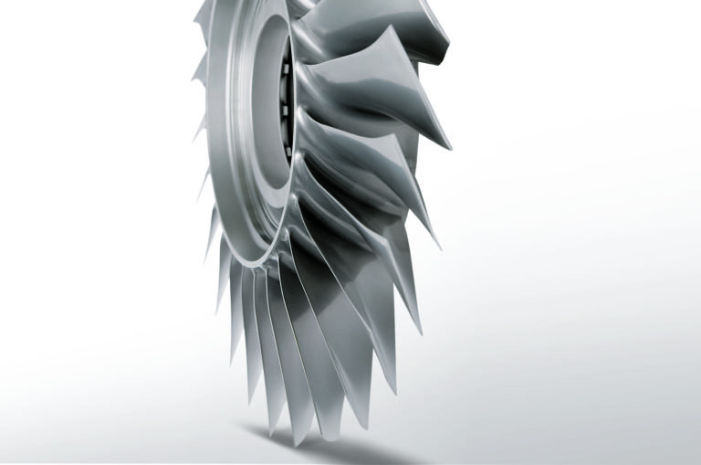 Metal component with curved blades
