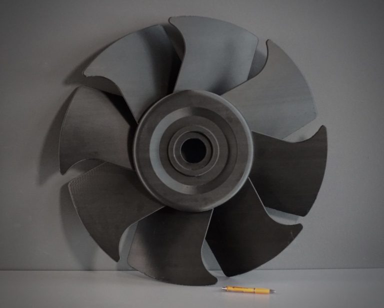 Large polymer impeller shown with a pencil for scale — BigRep