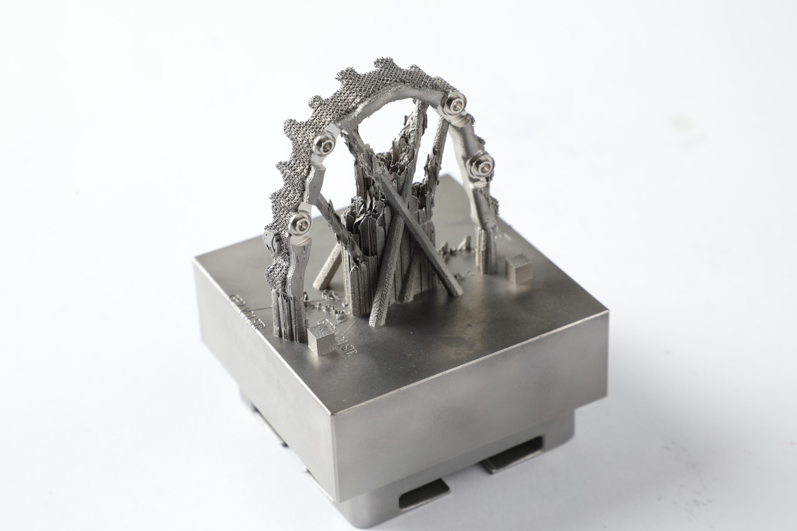 Example of a metal dental part with its supports on a build plate