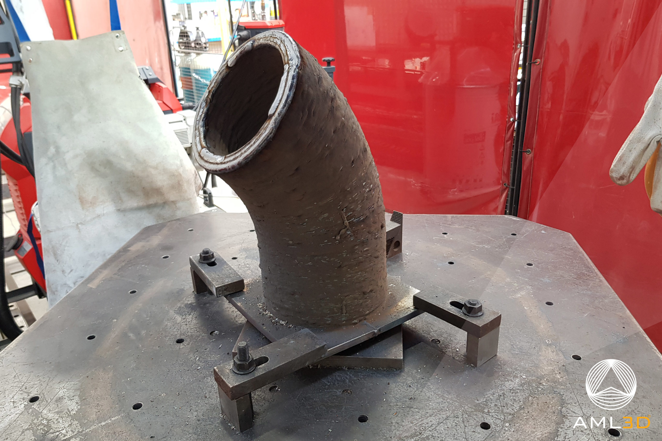 Metal pipe elbow made by wire-arc deposition
