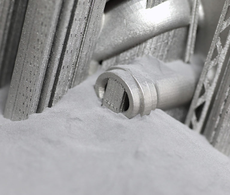 Metal part and supports surrounded by unfused powder