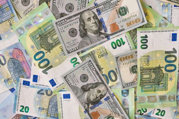 Euro and US dollar banknotes, illustrating business funding