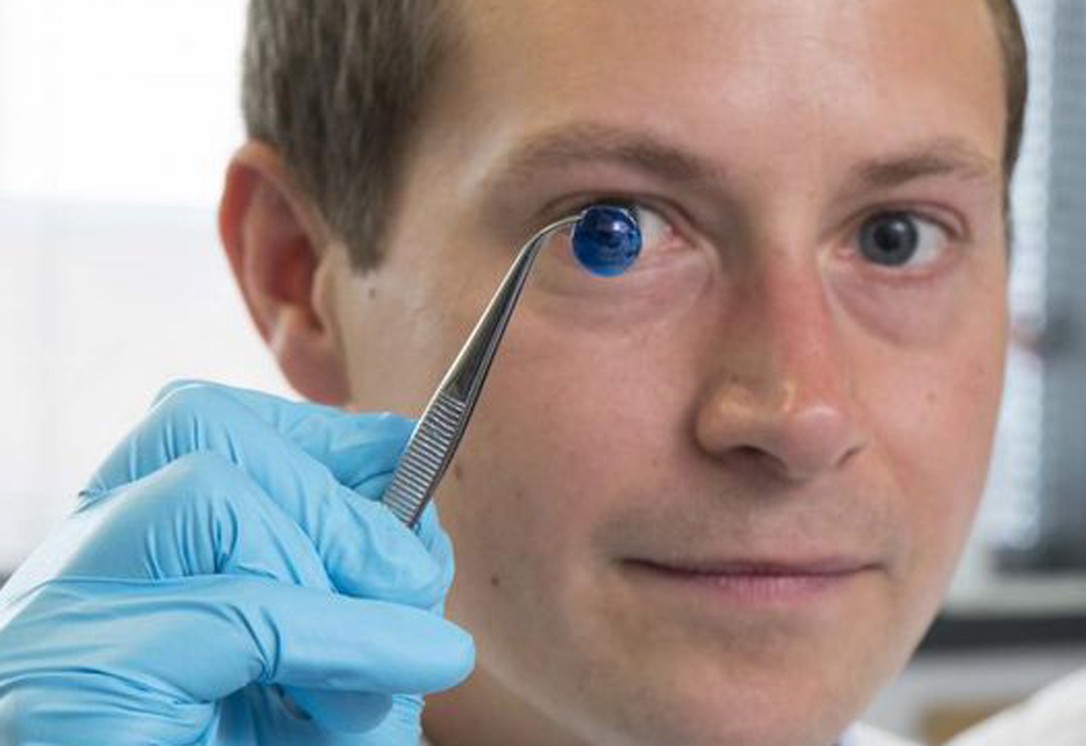 Steve Swioklo with an experimental bioprinted corneal structure