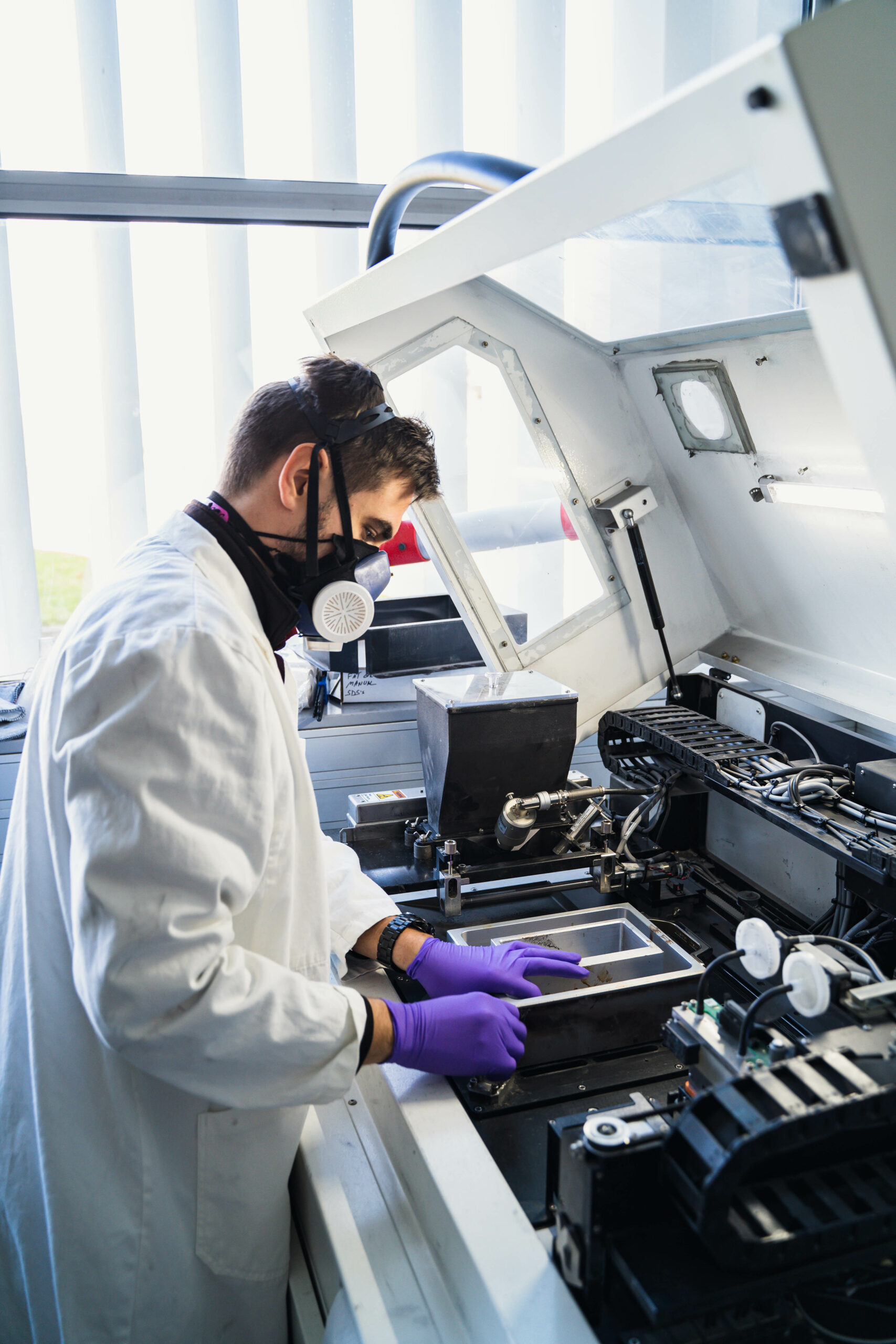 Operator working on a machine at JPB Système