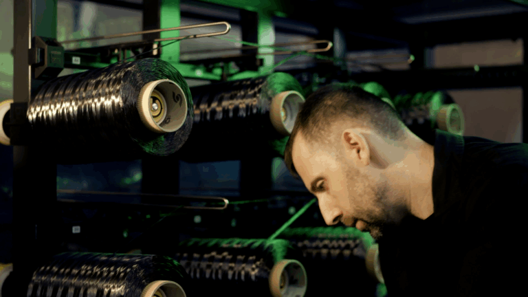 Technician beside fibre spools at the Reinforce3D facilities