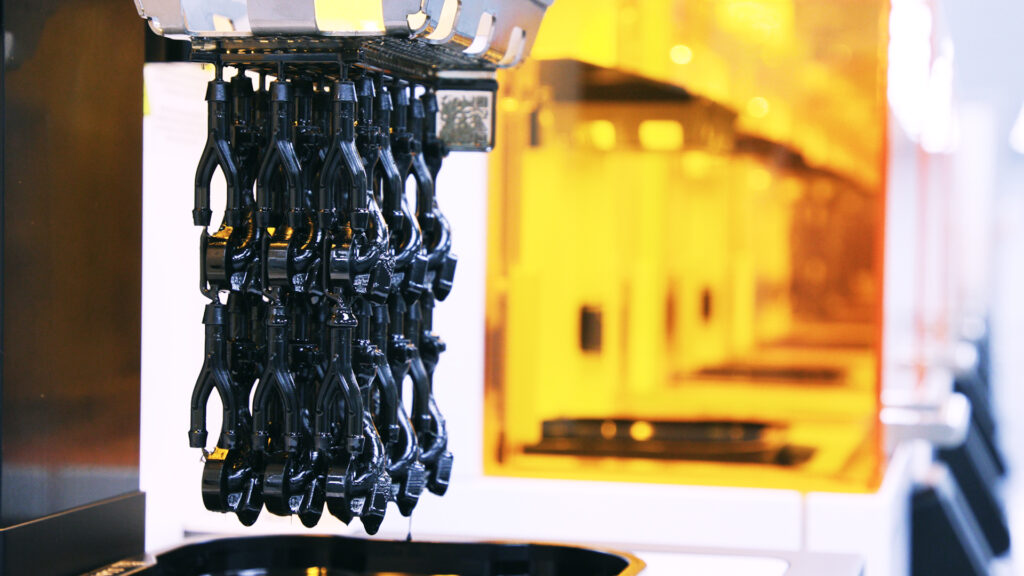 Part coming out of a 3D printer