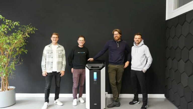 4 men with a machine