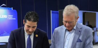 Two men signing a MoU