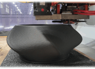 FOCUS | Évaluation du rendement de production et de l’intégration des flux de travail avec le système LFAM de Thermwood 3D printed part being produced by a 3D printer