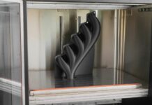 AON3D claims to cut print times up to 54% with physics-based slicing AON3D Hylo 3D Printed Manifold inside a build chamber