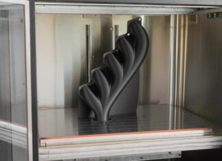 AON3D prétend réduire les temps d’impression jusqu’à 54 % grâce à un découpage basé sur la physique AON3D Hylo 3D Printed Manifold inside a build chamber