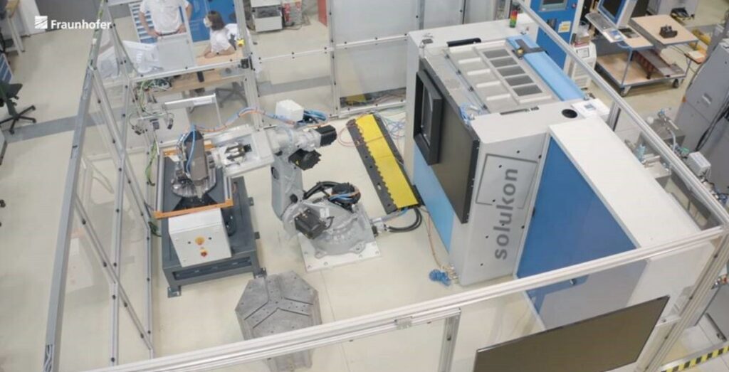 Robot connected to a depowdering system
