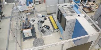 Robot connected to a depowdering system