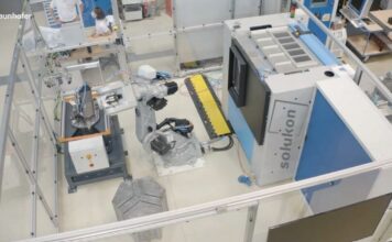 Robot connected to a depowdering system