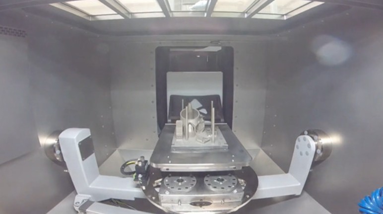 Metal component mounted inside a Solukon depowdering chamber.