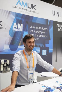Man standing behind a desk