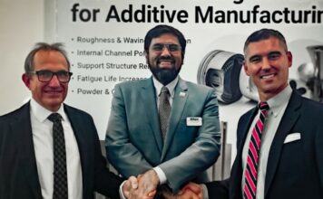 Three men signing a MoU