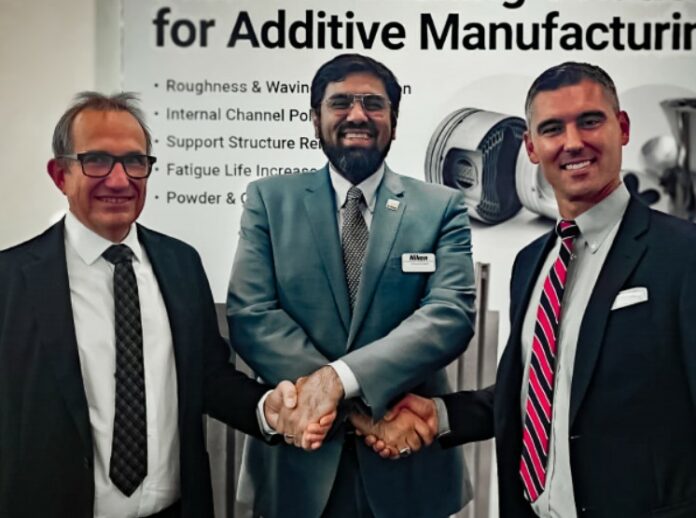 Three men signing a MoU