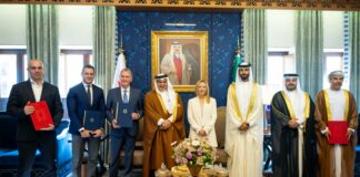 Authorities from Bahrain and Italy standing for a group picture