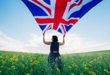 woman-holding-the-british-flag-outdoors