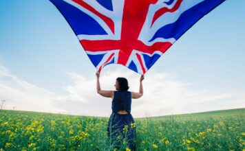 woman-holding-the-british-flag-outdoors
