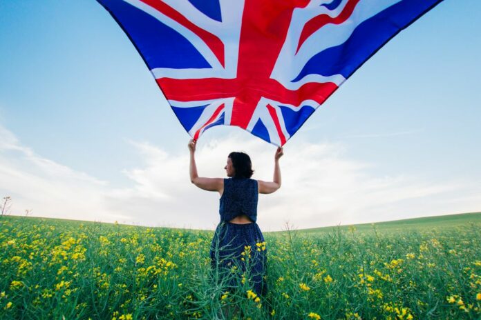 woman-holding-the-british-flag-outdoors-WEB-3DADEPT woman-holding-the-british-flag-outdoors
