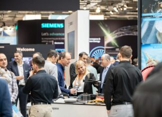 Group of people discussing on a booth an industry event