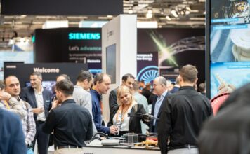 Group of people discussing on a booth an industry event