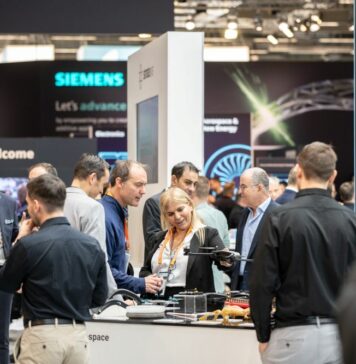 Group of people discussing on a booth an industry event