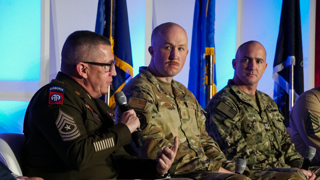 Panel of 4 men at a military event