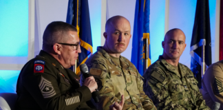 Panel of 4 men at a military event