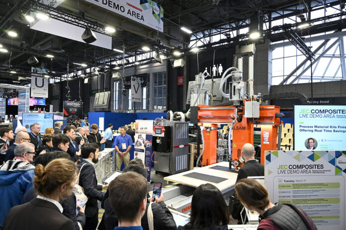 23441555 People gathering around a live demo