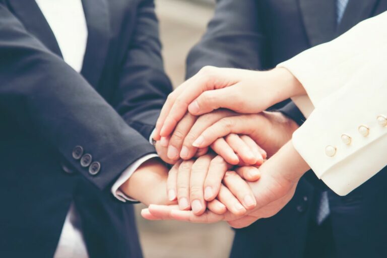 Hands joined to illustrate an industry alliance