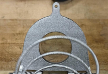 On-orbit deployment by NASA JPL and Proteus Space shows AM simplifies deployable structures Close-up of the additively manufactured titanium deployment spring inside the JPL Additive Compliant Canister (JACC), highlighting the integrated mechanism design made possible by additive manufacturing.