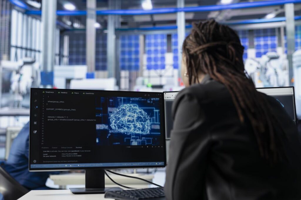 Production data and a 3D model displayed on a factory workstation