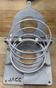 Close-up of the additively manufactured titanium deployment spring inside the JPL Additive Compliant Canister (JACC), highlighting the integrated mechanism design made possible by additive manufacturing.