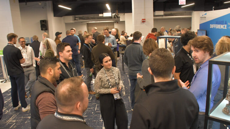 Participants networking at an AMUG conference