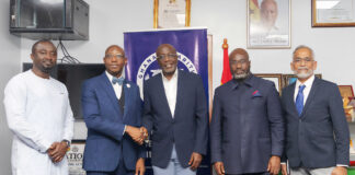 A group of men shaking hands