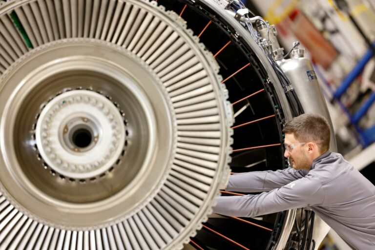 Technician working on an aircraft engine