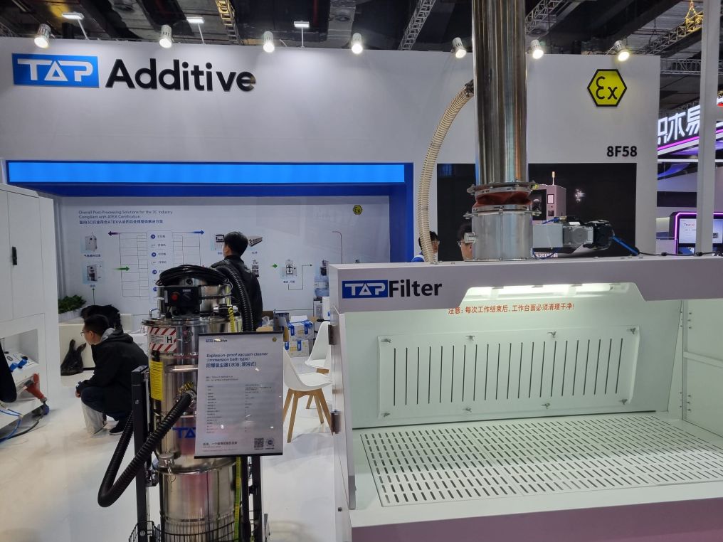 Post-processing equipment showcased at a booth