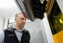 Man looking at a build platform