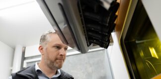 Man looking at a build platform