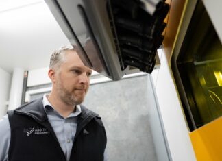 Man looking at a build platform