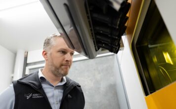 Man looking at a build platform