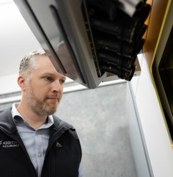 Man looking at a build platform