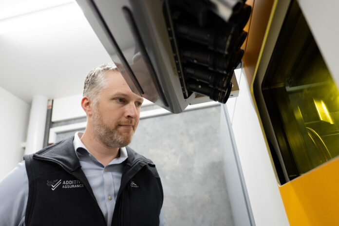 Man looking at a build platform