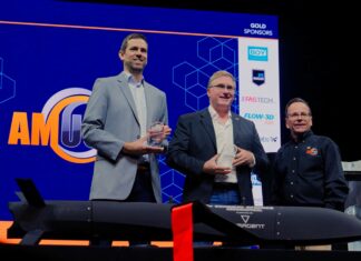 2 keynote speakers receiving their award at AMUG 2026, award given by the MC, Todd Grimm on the picture as well