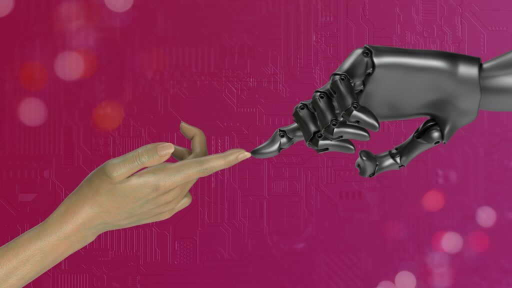 Une main humaine et une main robotique tendues l’une vers l’autre